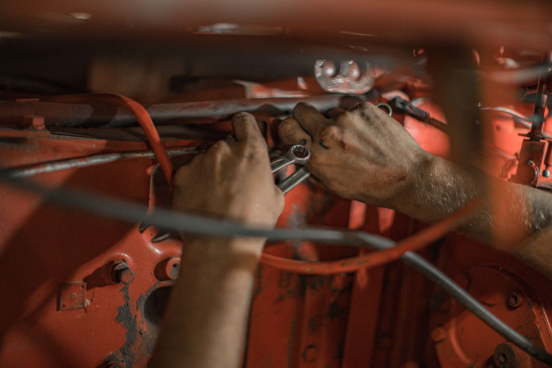 mechanics hands fixing something
